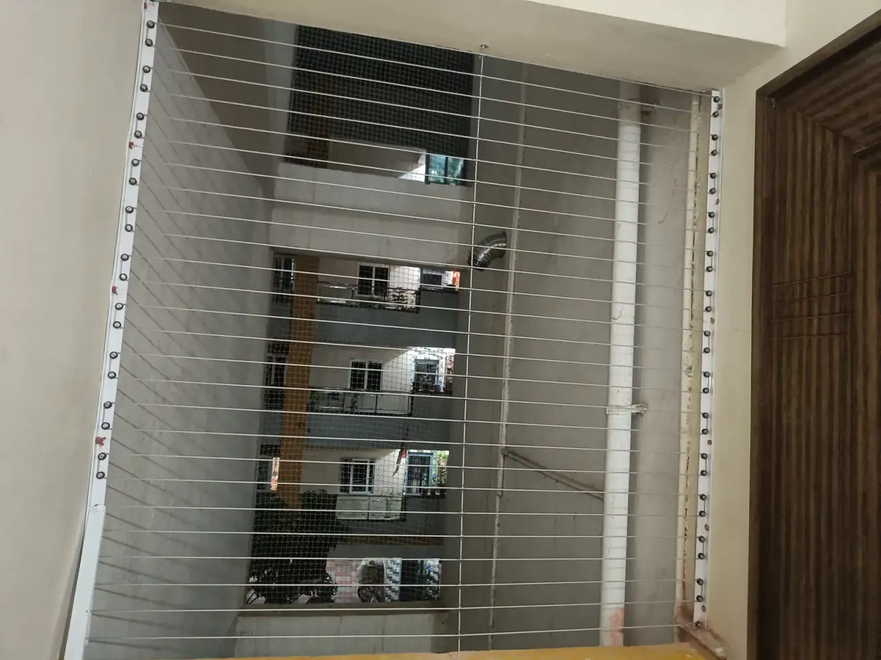 Window Invisible Grills installation by Perumal Safety Nets