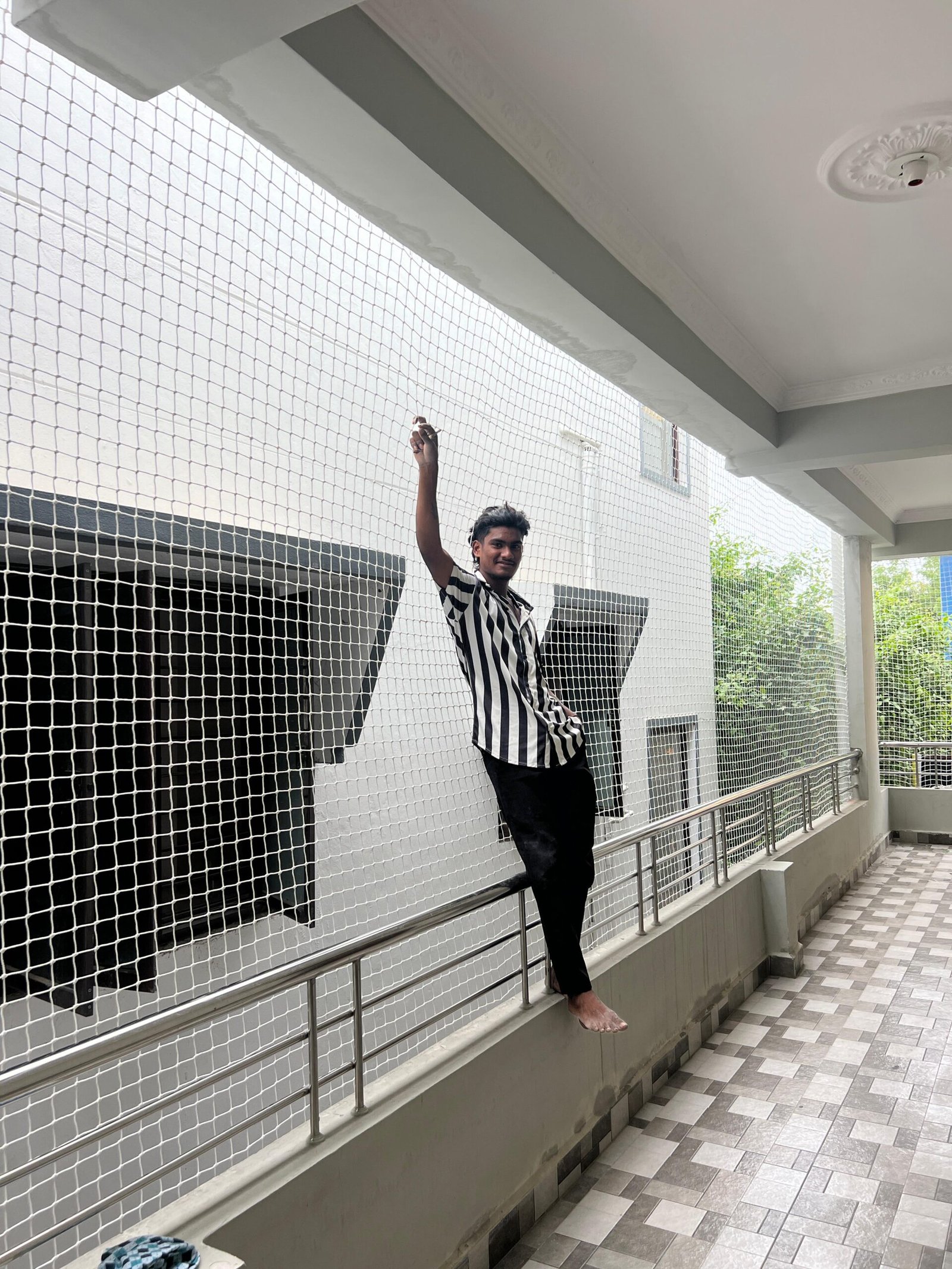 Pigeon net fitted across an apartment balcony in Chennai