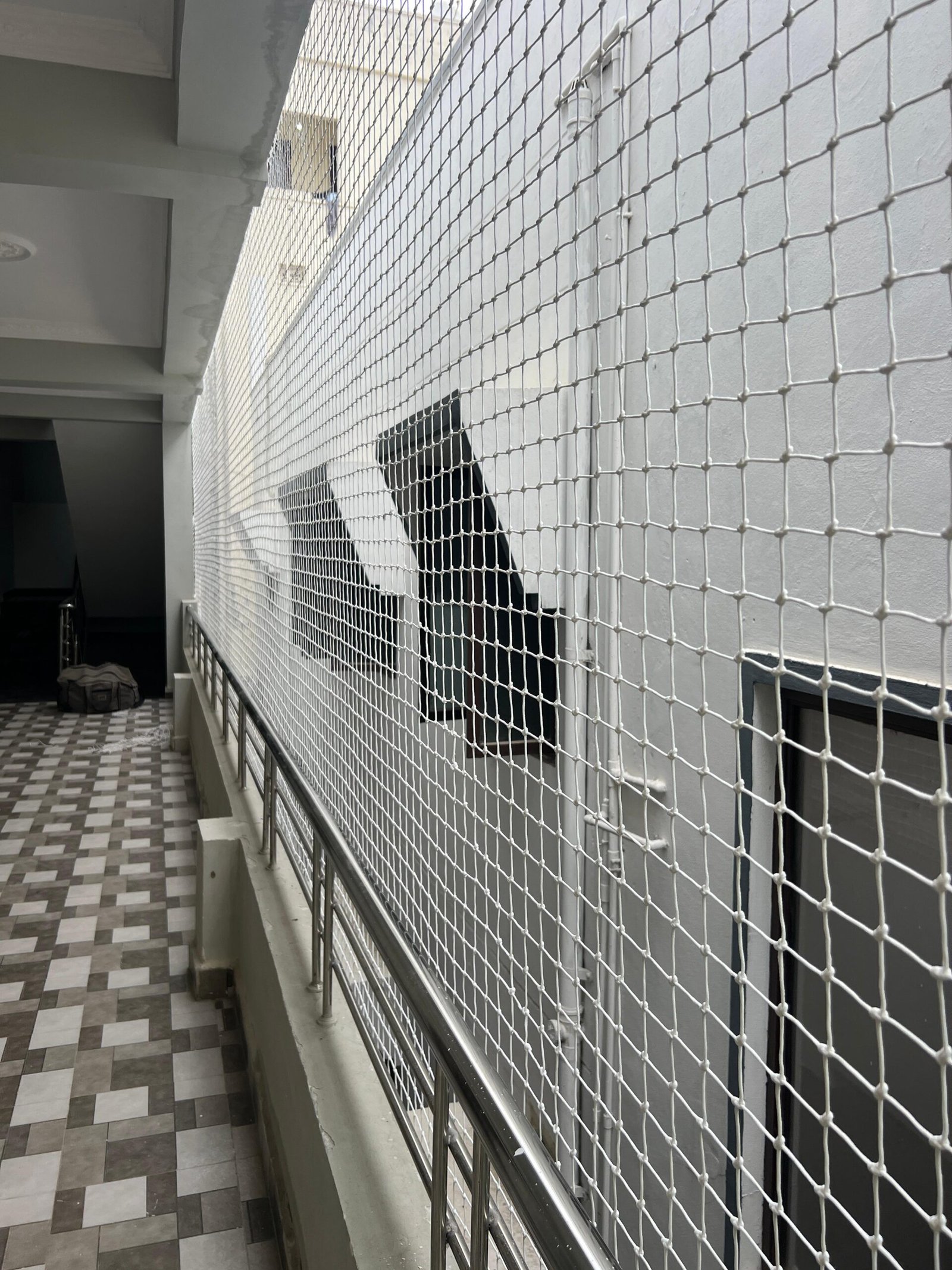 Pigeon net installed across a residential balcony