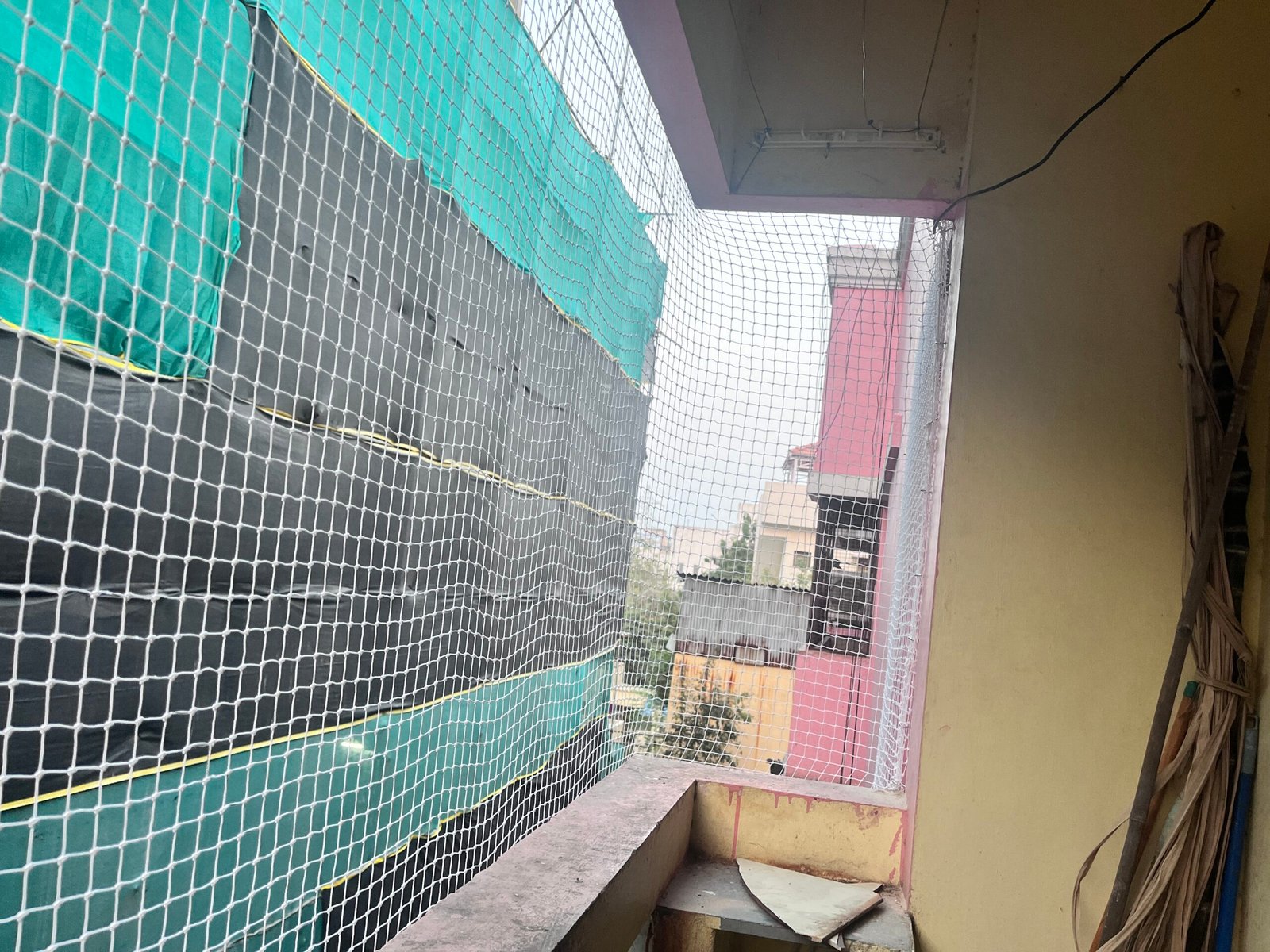 Anti-bird net installed in a utility area