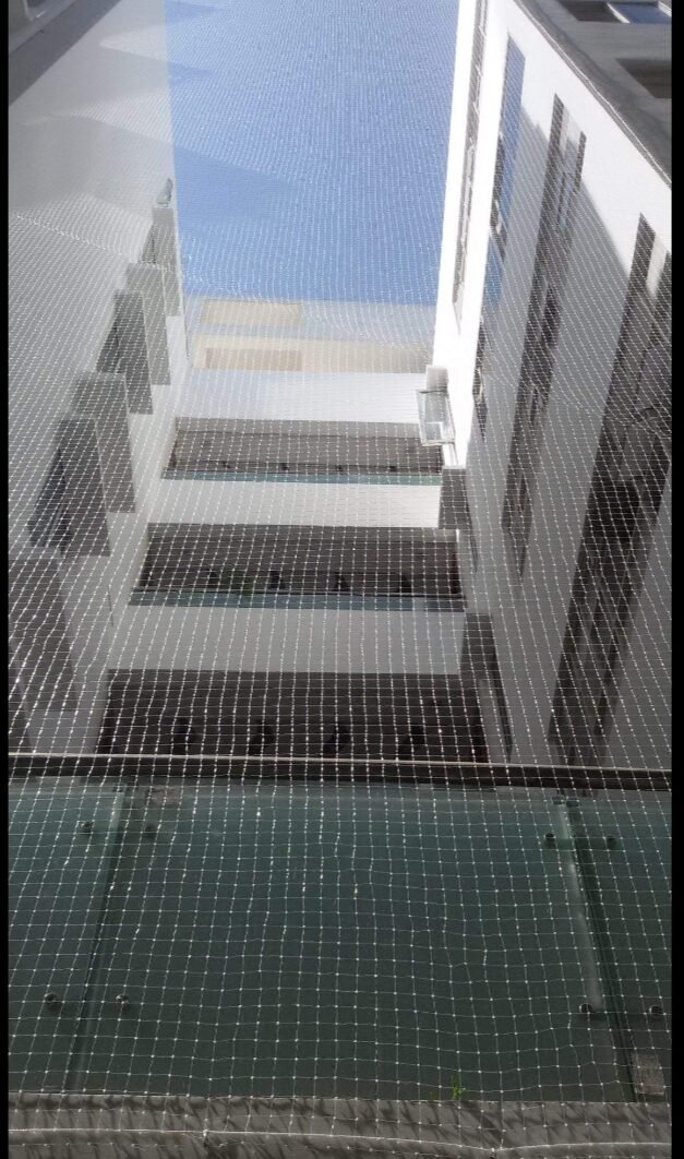 Duct area bird net fitted in an apartment
