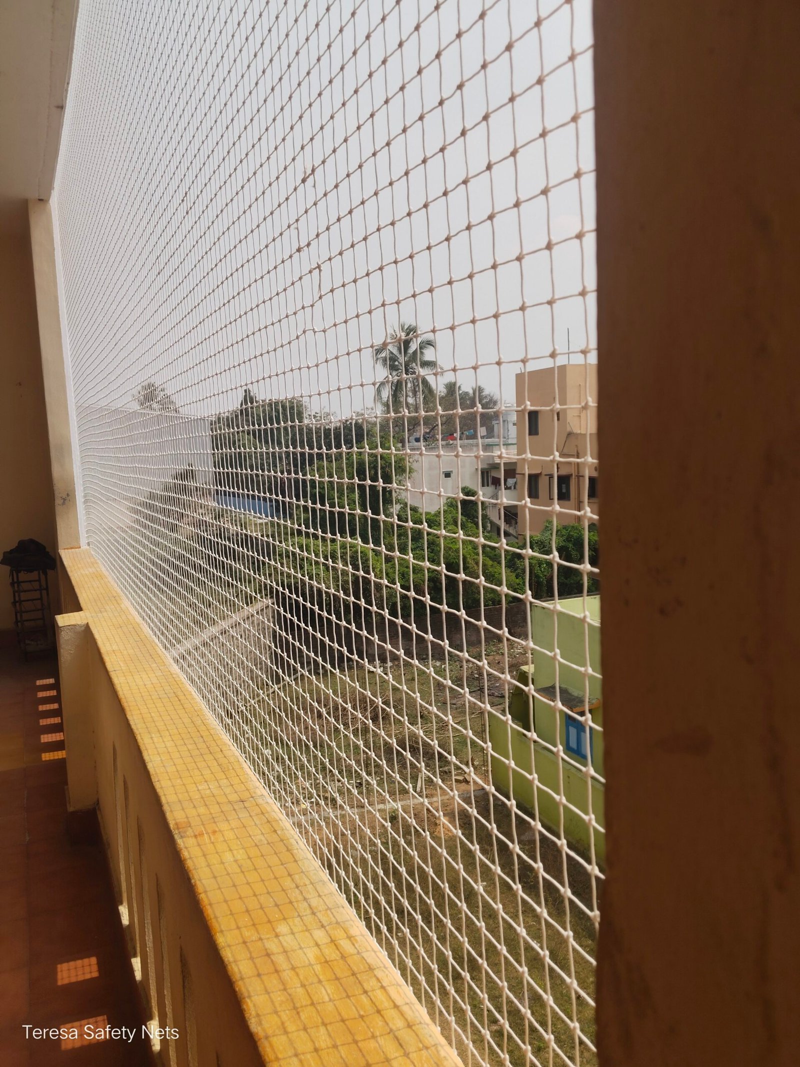 Safety net installed on an apartment balcony in Chennai