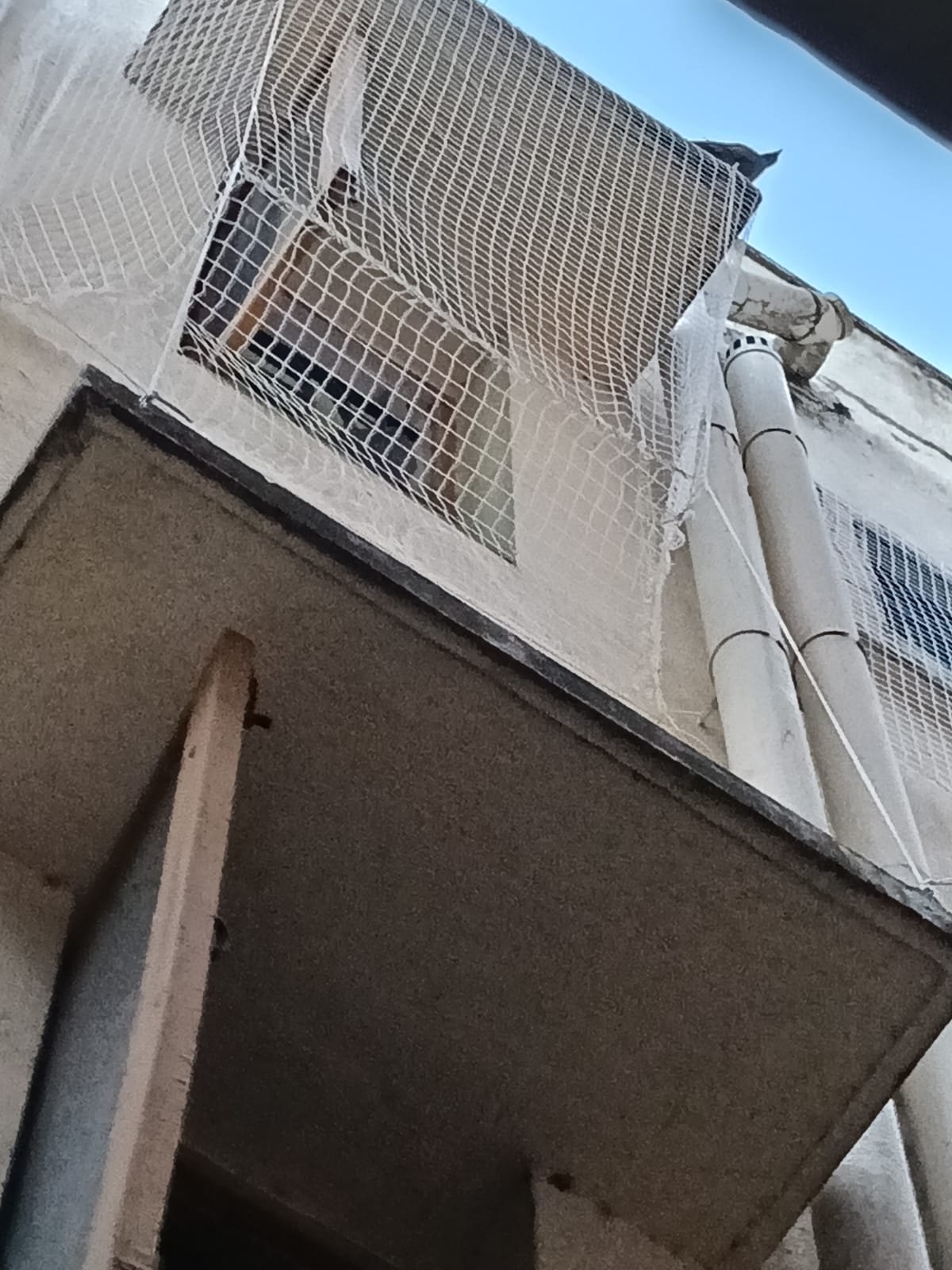 Safety net secured over a residential window
